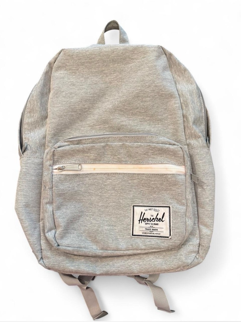 HERSCHEL SUPPLY Co. grey laptop backpack with red stripe lining.